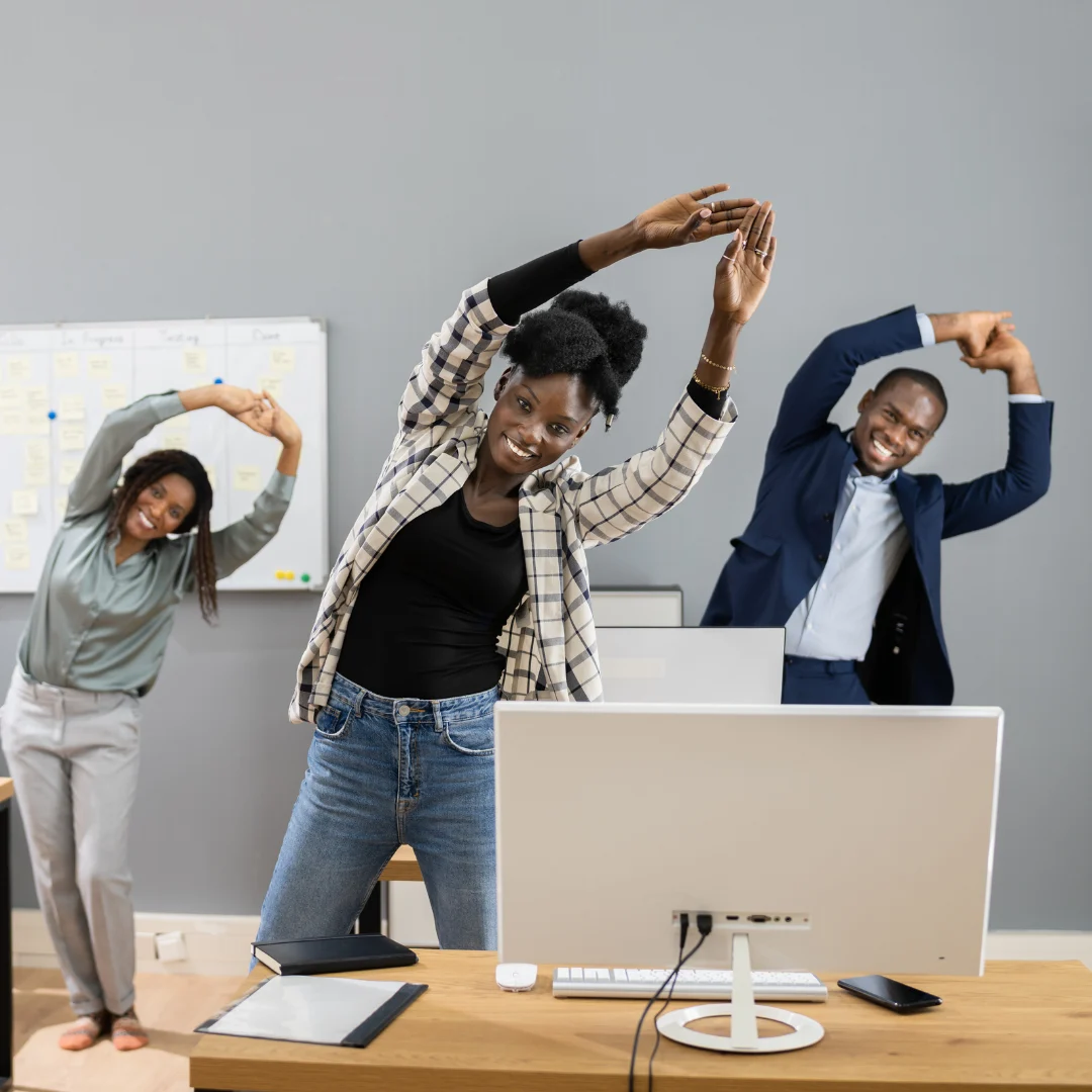 People doing simple stretches at a desk